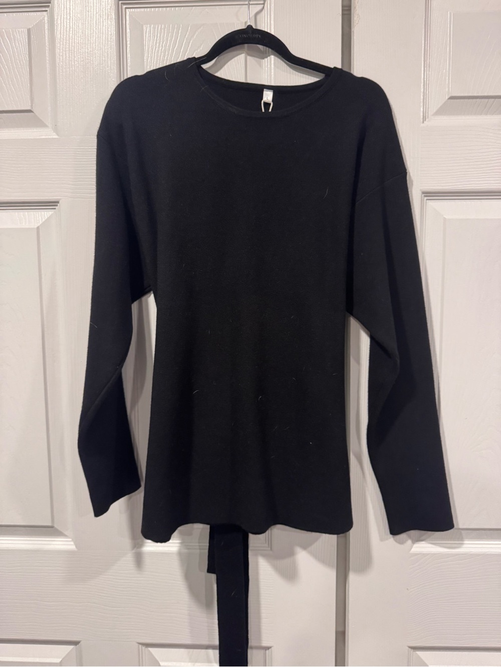 Yeokou black long-sleeve crewneck top with back tie detail